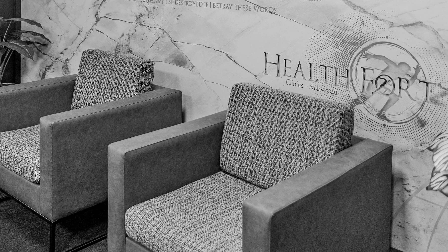 The waiting room at Healthfort Clinics Milnerton, with the Hippocratic Oath printed across the wall